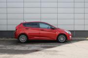 Красный Hyundai Solaris 1.4 AT (107 л.с.) 2014 фото 4