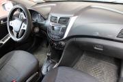 Красный Hyundai Solaris 1.4 AT (107 л.с.) 2014 фото 10