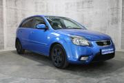 Синий Kia Rio 1.4 MT (97 л.с.) 2010 фото 2