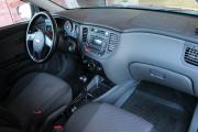 Красный Kia Rio 1.4 AT (95 л.с.) 2011 фото 10