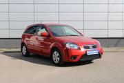 Красный Kia Rio 1.4 AT (95 л.с.) 2011 фото 2