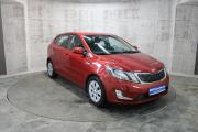 Красный Kia Rio 6-speed 1.6 MT (123 л.с.) 2014 фото 2